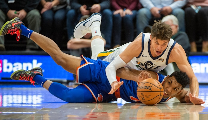 (Rick Egan  |  The Salt Lake Tribune)   Utah Jazz guard Kyle Korver (26) goes after loose ball along with New York Knicks guard Allonzo Trier (14) in NBA action between Utah Jazz and New York Knicks, in Salt Lake City, Saturday, Dec. 29, 2018.