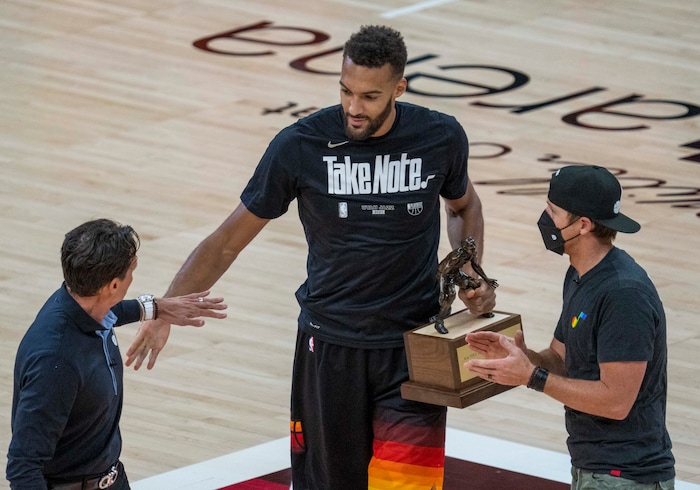 (Rick Egan | The Salt Lake Tribune) Utah Jazz center Rudy Gobert (27) receives the NBA's Defensive Player of the Year award for the third time in his career before Game 2 of the Westen COnference Semifinals against the LA Clippers at Vivint Arena, on Thursday, June 10, 2021.