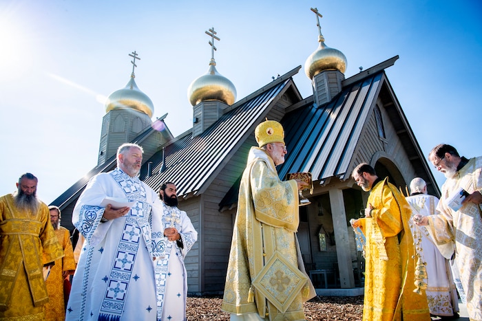 (Isaac Hale | Special to The Tribune) Metropolitan Joseph, leader of the Antiochian Orthodox Christian Archdiocese of North America, along with clergy and members of the congregation process around the church during a consecration service for St. Xenia Orthodox Church in Payson on Saturday, July 16, 2022.