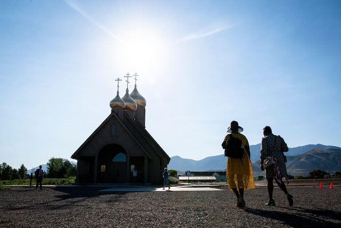 (Isaac Hale | Special to The Tribune) Members of the congregation make their way inside before a consecration service for St. Xenia Orthodox Church in Payson on Saturday, July 16, 2022.