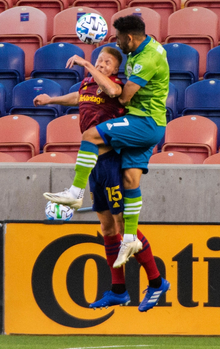 (Rick Egan  |  The Salt Lake Tribune)     Real Salt Lake defender Justen Glad (15) and Seattle Sounders midfielder Cristian Roldan (7) go for the ball, in MLS soccer action between Real Salt Lake and the Seattle Sounders, at Rio Tinto Stadium, Wednesday, Sept. 2, 2020.