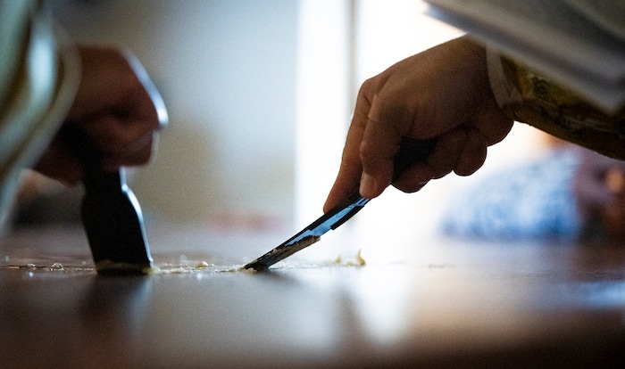 (Isaac Hale | Special to The Tribune) Priests, deacons and subdeacons seal the niche containing the reliquary in the holy table with wax during a consecration service for St. Xenia Orthodox Church in Payson on Saturday, July 16, 2022.