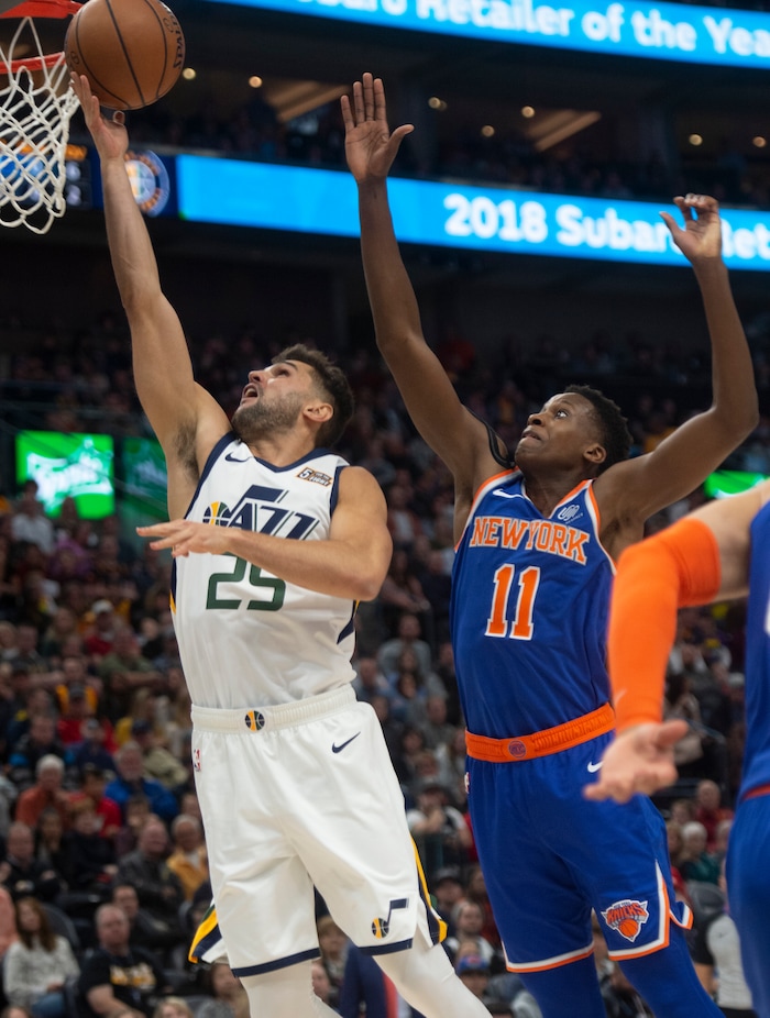 (Rick Egan  |  The Salt Lake Tribune)  Utah guard Raul Neto (25) gets past New York Knicks guard Frank Ntilikina (11) to score for the Jazz, in NBA action between Utah Jazz and New York Knicks, in Salt Lake City, Saturday, Dec. 29, 2018.